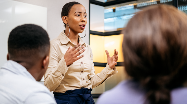 Woman speaking in front of audience